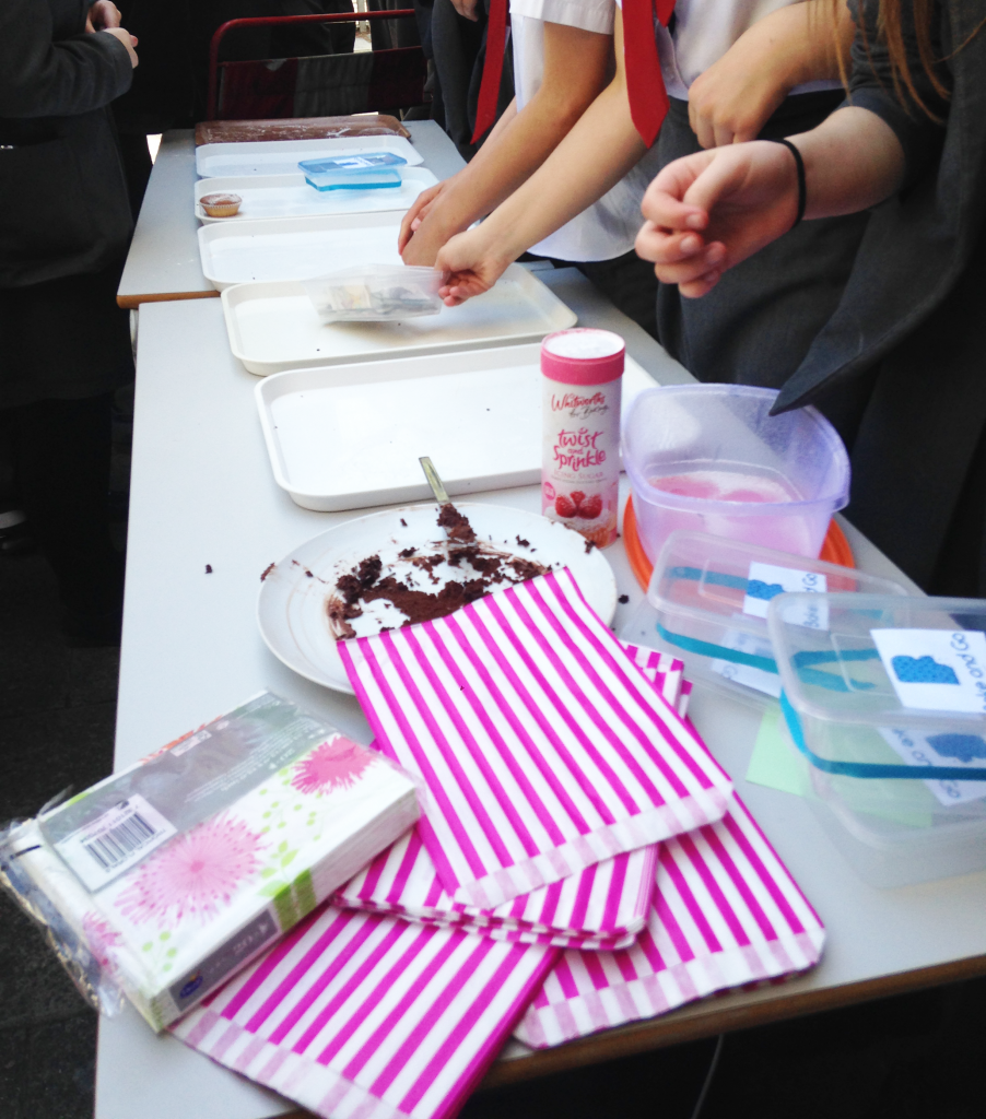 Empty trays for each business after their cupcake sale day